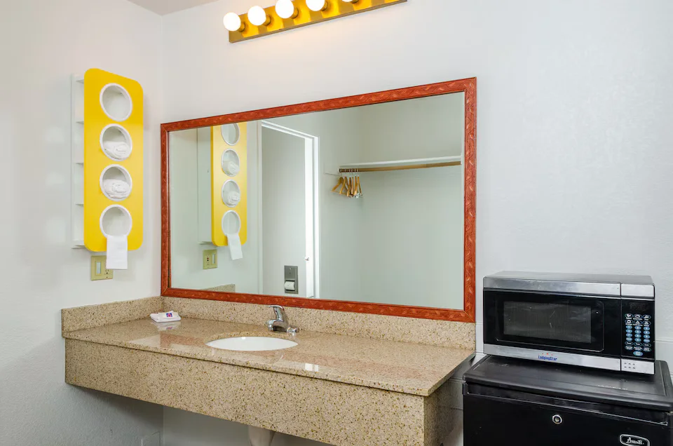 Vanity, microwave and fridge